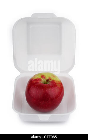 front view of a red apple on open empty white meal foam tray pack isolated Stock Photo