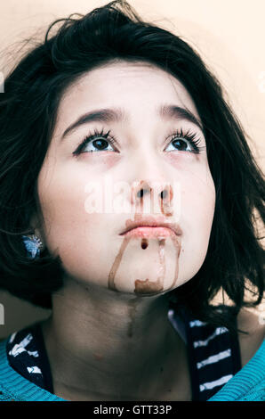 young beautiful upset girl nosebleeding Stock Photo