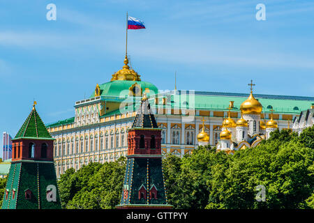 State Flag of the Russian Federation waves over the Grand Palace of Moscow Kremlin. Stock Photo