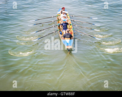 Venice, Italy - May 20, 2016: Female crew is training on a rowing boat in Venice. Stock Photo