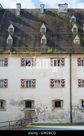 Windows in the medieval facade and roof of the ducal granary in the castle of Wasserburg am Inn, Bavaria, Germany Stock Photo
