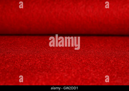 Red velvet surface. Table and blurred background Stock Photo
