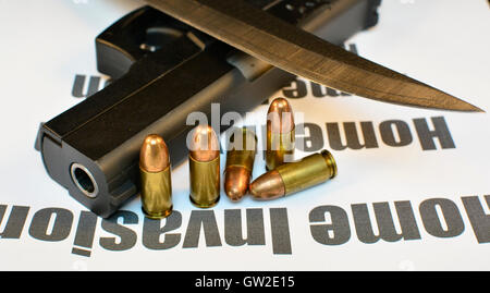 Crime Home Invasion Handgun with bullets and knife. Gun violent crime, assault. Shooting. Stock Photo