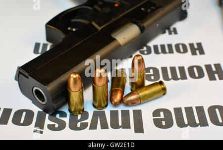 Crime Home Invasion. Handgun with bullets gun violent crime, assault. Shooting. Stock Photo