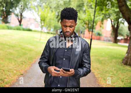 young man checking his phone Stock Photo
