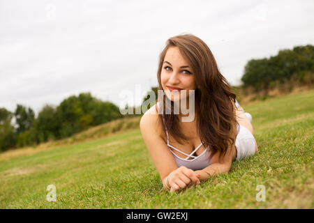 pretty girl lying in the park Stock Photo