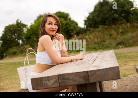 young woman enjoying her day in the park Stock Photo