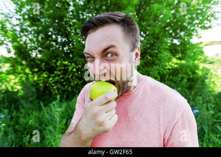 Man eating oranger Stock Photo