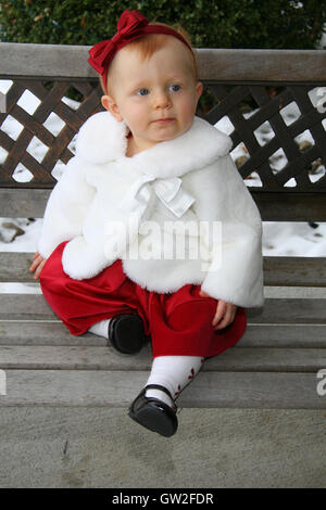 Little Girl in Christmas Outfit Stock Photo