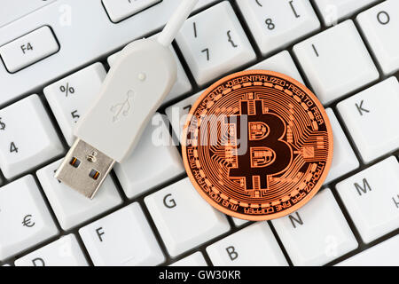 Bitcoin on computer keyboard, virtual currency Stock Photo