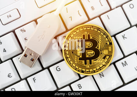 Bitcoin on computer keyboard, virtual currency Stock Photo