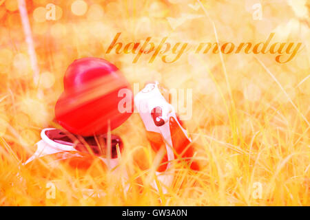 Happy Monday message with a miniature motorcycle carrying a heart cushion Stock Photo