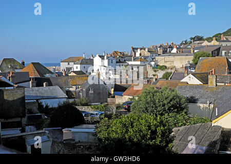 A view over the rooftops of Lyme Regis houses looking towards the sea and Cobb in  Dorset, England UK    KATHY DEWITT Stock Photo