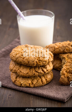 Oat cookies and milk on napkin Stock Photo