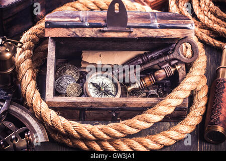 Old wooden box and nautical instruments Stock Photo
