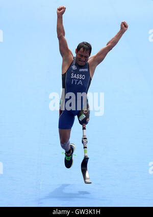 Italy's Giovanni Sasso celebrates as he crosses the line in 9th in the Men's Triathlon PT2 during the third day of the 2016 Rio Paralympic Games in Rio de Janeiro, Brazil. Stock Photo