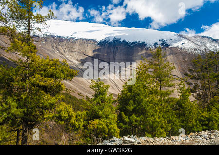 Landscapes Snow Mountains Nature Morning Viewpoint.Mountain Trekking Landscape Background. Nobody photo.Asia Horizontal picture. Sunlights White Clouds Blue Sky. Himalayas Rocks. Stock Photo