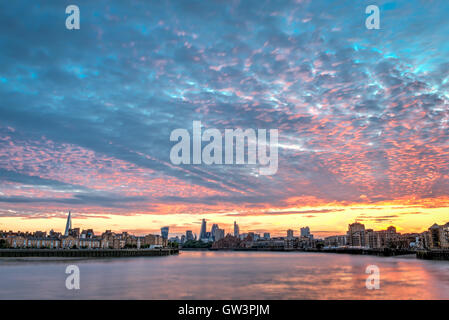 London, United Kingdom - July 23, 2016: Colourful sunset over London skyline, with London City and Shard, view from Canary Wharf Stock Photo
