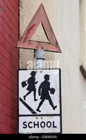 Old school crossing and warning triangle sign Stock Photo