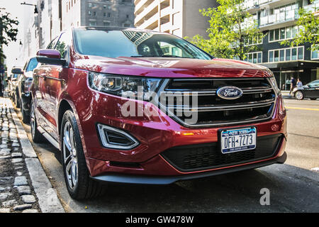 A new 2016 Ford Explorer parked in the street in Manhattan. Stock Photo