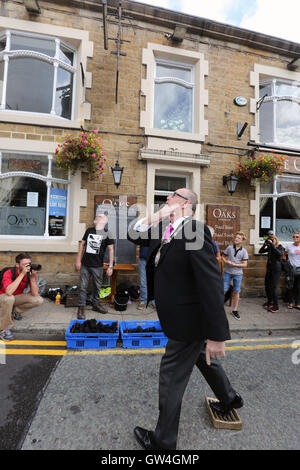 Ramsbottom, UK. 11th September, 2016. The Mayor, Councillor Mike Connolly opens the World black Pudding lobbing Championship by throwing a Black Pudding,  Ramsbottom, Lancashire, 11th September, 2016 Credit:  Barbara Cook/Alamy Live News Stock Photo