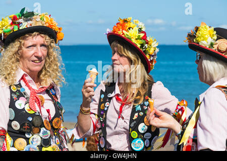 Swanage, Dorset, UK. 11th Sep, 2016. Crowds flock to the second day of the Swanage Folk Festival on a glorious warm sunny day to see the dance groups and music along the seafront. Morris dancers, members of Phoenix Morris stop for an ice cream break. Credit:  Carolyn Jenkins/Alamy Live News Stock Photo