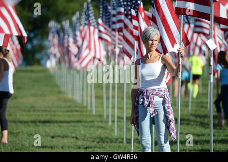 Saint Louis, MO – September 11, 2016: More than 7,000 flags with name, photo and dog tag of soldier killed defending the United States wave outside the St. Louis Art Museum in Saint Louis, Missouri Credit:  Gino's Premium Images/Alamy Live News Stock Photo