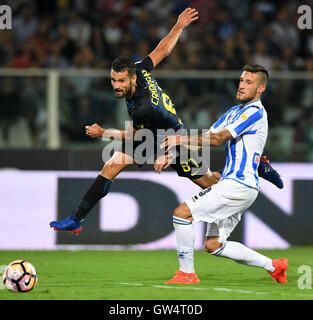 Pescara, Italy. 11th Sep, 2016. Antonio Candreva(L) of Inter Milan vies with Cristiano Biraghi of Pescara during their Italian Serie A football match in Pescara, Italy, Sept. 11, 2016. Inter Milan won 2-1. Credit:  Alberto Lingria/Xinhua/Alamy Live News Stock Photo