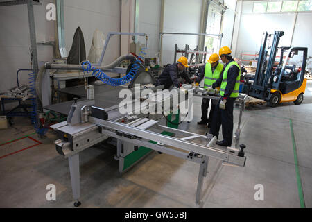CNC machine shop with lathes, technicians and workers Stock Photo