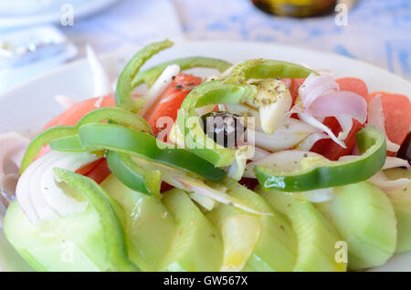 Olives and sliced cucumbers and tomatoes plate from a traditional Lebanese  breakfast with labneh and cheese in the background Stock Photo - Alamy