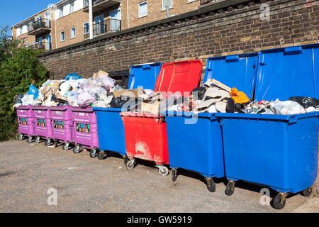 Overflowing mixed recycling bins in Limehouse, Tower Hamlets, London Stock Photo