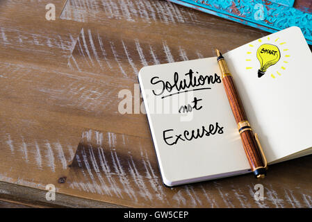 Retro effect and toned image of notebook next to a fountain pen. Business concept image with handwritten text Stock Photo