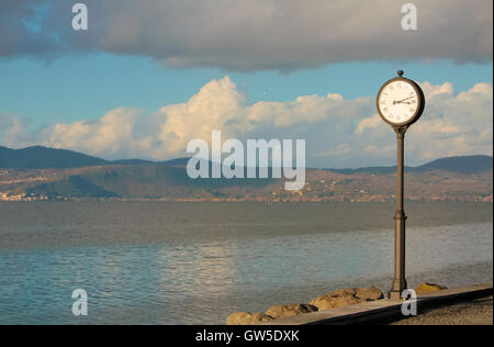 Pole clock and lake panorama in Anguillara Sabazia (Italy, Lazio) Stock Photo
