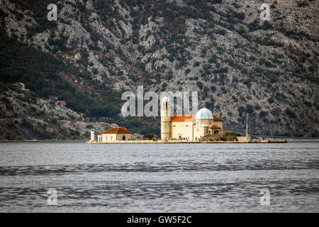 Bay of Kotor, Montenegro - Lighthouse and catholic church on the islet Our Lady of the Rocks (Gospa od Skrpjela) Stock Photo