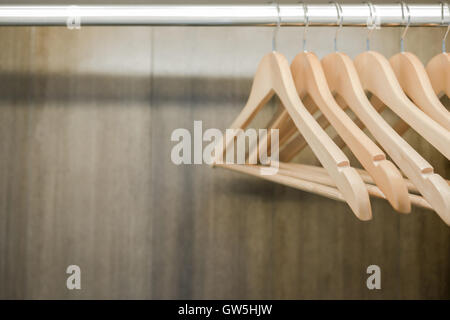 Clothes hanger in wardrobe. Copy space. Stock Photo