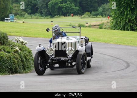David Marsh guides his 1923 Vauxhall 30-98 into the roundabout at the 2016 Chateau Impney Hill Climb Stock Photo