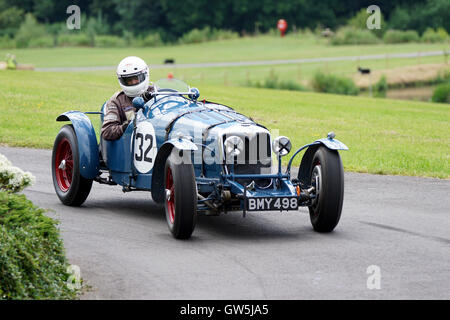 Richard Iliffe places his 1934 Riley 12/4 Special into the roundabout at the 2016 Chateau Impney Hill Climb Stock Photo