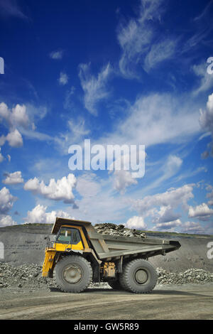 Heavy mining truck loaded with iron ore on the opencast side view Stock Photo