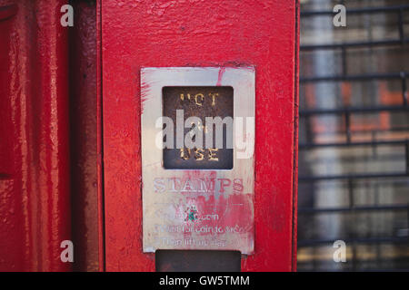 'Not in use' sign on disused stamp machine on post box in Walthamstow, North-East London. Stock Photo