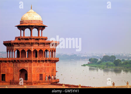 Red corner tower of Taj Mahal complex overlooking the river in Agra, India Stock Photo