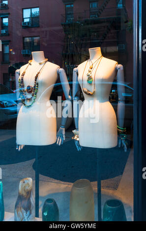 Window display of exotic jewelry on manikins in New York City Stock Photo