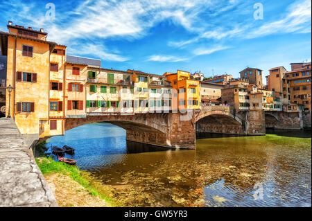 The Ponte Vecchio, or Old Bridge, is a medieval stone arched bridge over Arno river in Florence, Italy Stock Photo