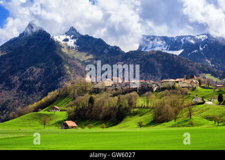 Gruyeres town, known for his world famous Gruyere cheese, laying on a hill in the Alps mountains, Switzerland Stock Photo