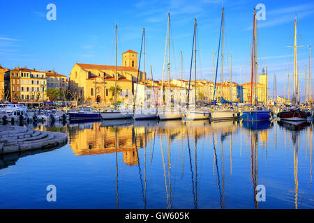 Yachts reflecting in blue water in the old town port of La Ciotat, Marseilles district, France, in the evening light Stock Photo