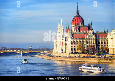 Cruise ships going by Parliament building down the Danube river, Budapest, Hungary Stock Photo