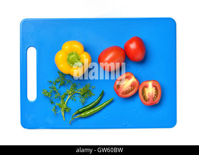 Yellow Bell Pepper, Tomato, Chili And Cilantro on Chopping Board Stock Photo