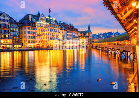 Lucerne, Switzerland, view of the old town from wooden Chapel bridge in the evening Stock Photo