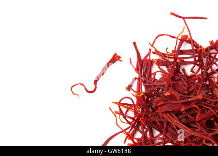 Heap of saffron isolated on white background, closeup, view from above. Stock Photo