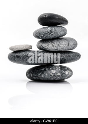 Stack of spa stones on white background Stock Photo - Alamy
