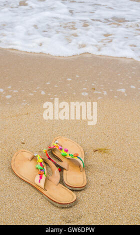Summer flip flops on the beach Stock Photo